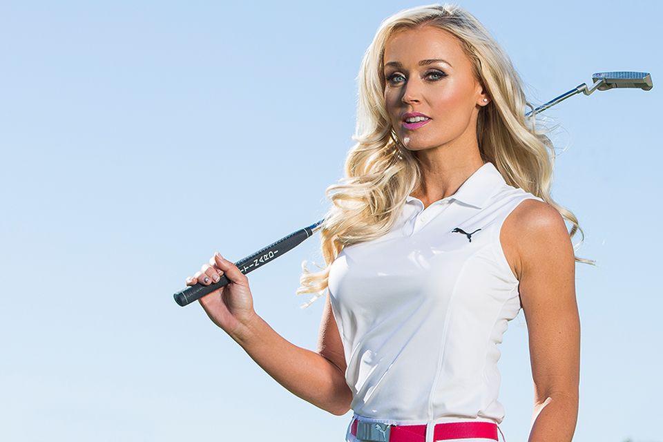 Blair O'Neal holding a golf club over her shoulder
